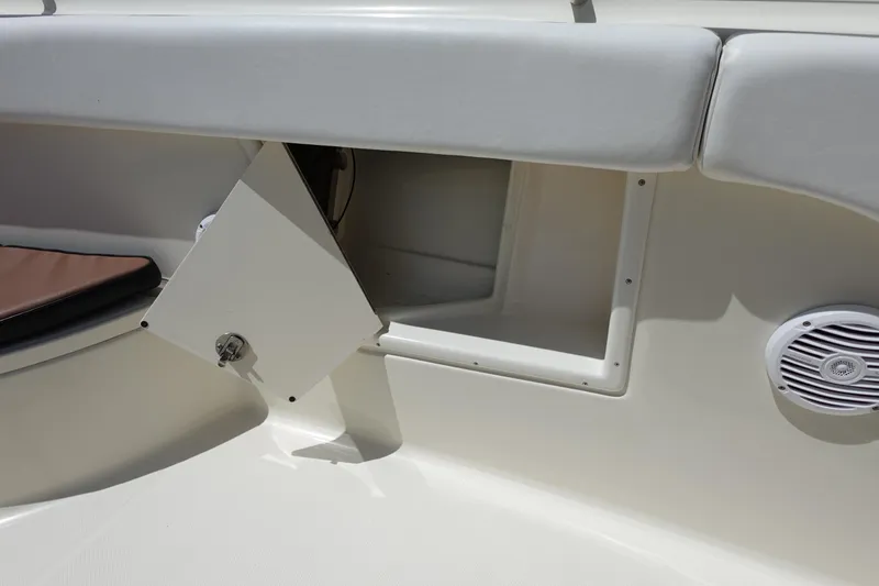 Slide: The Image of 2005 Hydra-Sports Vector 3300 CC boat interior with open storage compartment and speaker. - 42