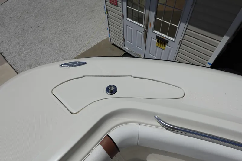 Slide: The Image of 2005 Hydra-Sports Vector 3300 CC boat deck with storage compartment and railing. - 49