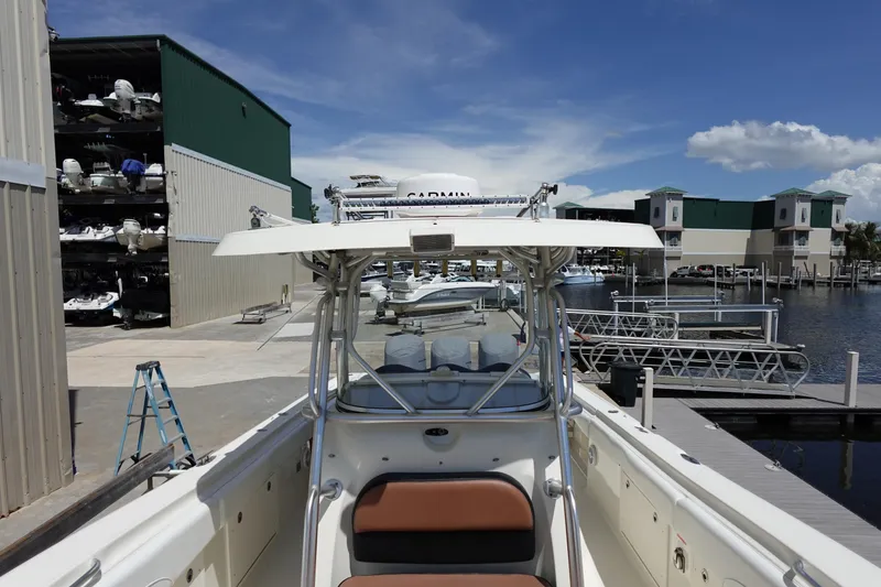 Slide: The Image of 2005 Hydra-Sports Vector 3300 CC boat docked at a marina under a clear blue sky. - 7