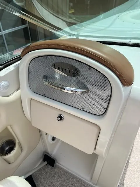 Slide: The Image of 2008 Chris-Craft Launch 28 boat interior with white cushioned seating. - 11