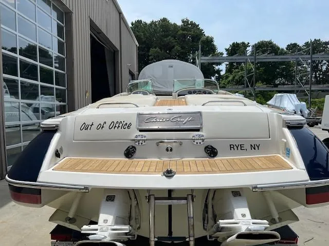 Slide: The Image of 2008 Chris-Craft Launch 28 boat on trailer, parked outdoors. - 4