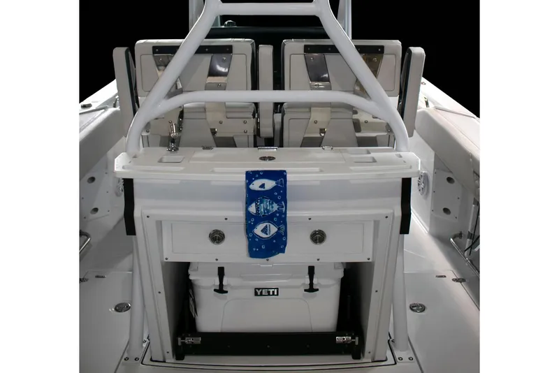 Slide: The Image of 2026 Blackfin 272 CC boat interior with Garmin navigation system and seating. - 12