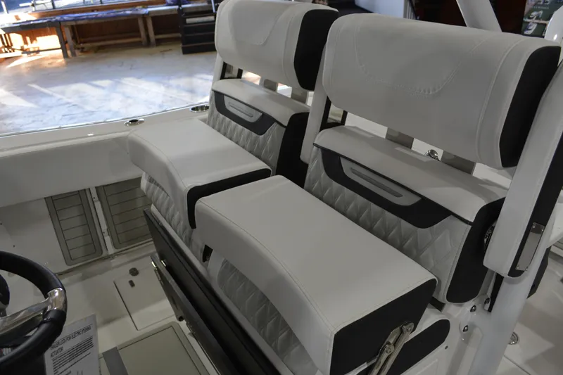 Slide: The Image of 2026 Blackfin 272 CC boat interior with luxurious white seating and modern design. - 17