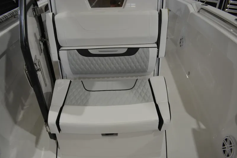Slide: The Image of 2026 Blackfin 272 CC boat interior with stylish, cushioned seating and modern design. - 18