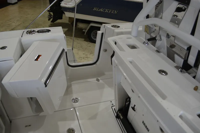 Slide: The Image of 2026 Blackfin 272 CC boat interior with sleek white design and modern features. - 23