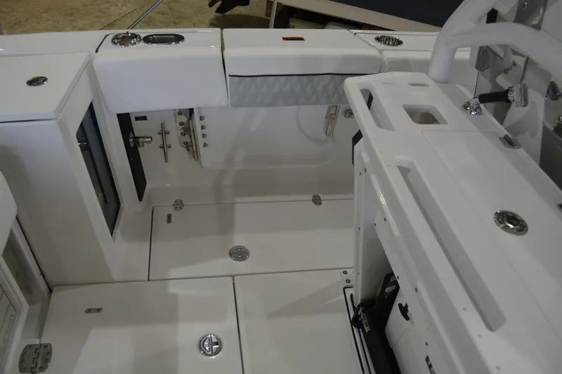 Slide: The Image of 2026 Blackfin 272 CC boat interior, featuring sleek white design and modern fittings. - 24