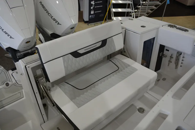 Slide: The Image of 2026 Blackfin 272 CC boat interior with Mercury engines and foldable seating. - 26
