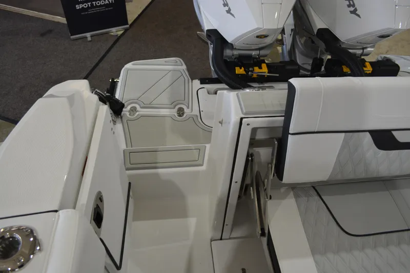 Slide: The Image of 2026 Blackfin 272 CC boat interior with dual Mercury engines, showcasing seating and storage. - 27