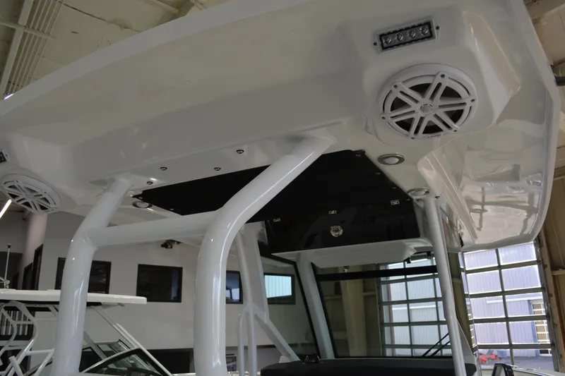 Slide: The Image of 2026 Blackfin 272 CC boat interior with speakers and lighting fixtures. - 31