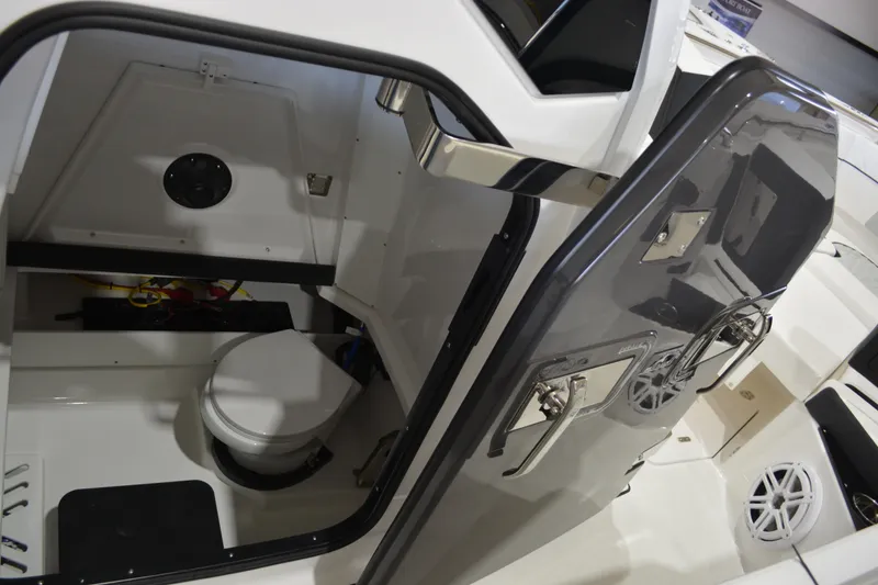 Slide: The Image of Interior view of 2026 Blackfin 272 CC boat's compact bathroom with toilet. - 32