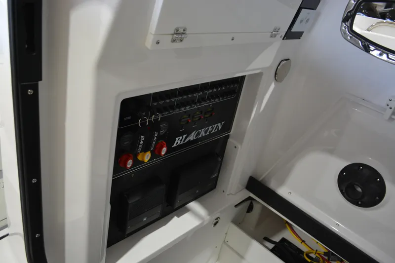 Slide: The Image of 2026 Blackfin 272 CC boat interior with control panel and storage area. - 35