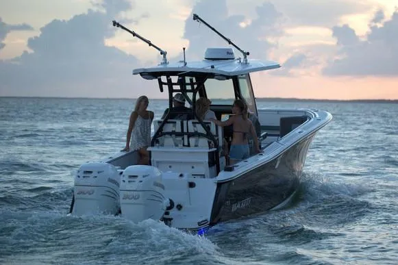 Slide: The Image of 2026 Blackfin 272 CC boat with twin 300 V8 engines in a showroom. - 5