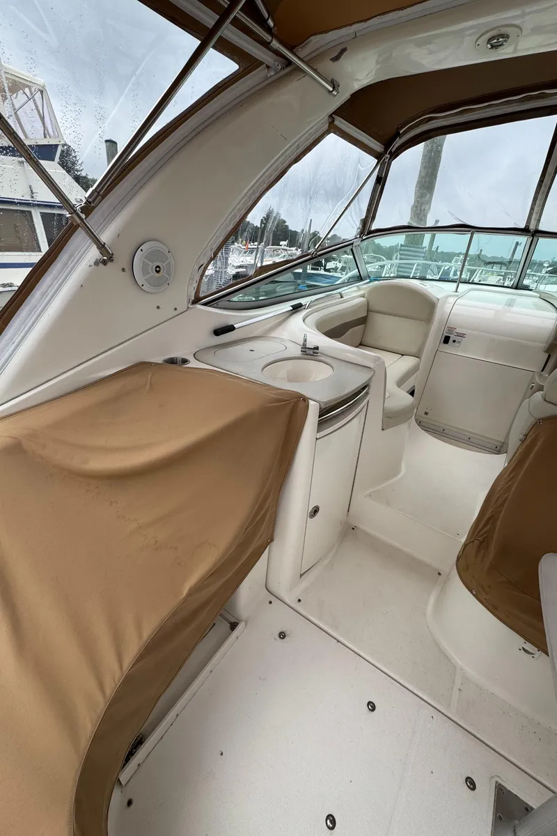 Slide: The Image of 2004 Chaparral 330 Signature boat interior with seating and covered areas. - 2