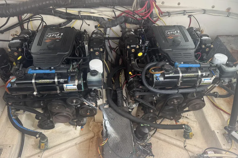 Slide: The Image of Twin MerCruiser engines in a 2004 Chaparral 330 Signature boat engine compartment. - 24