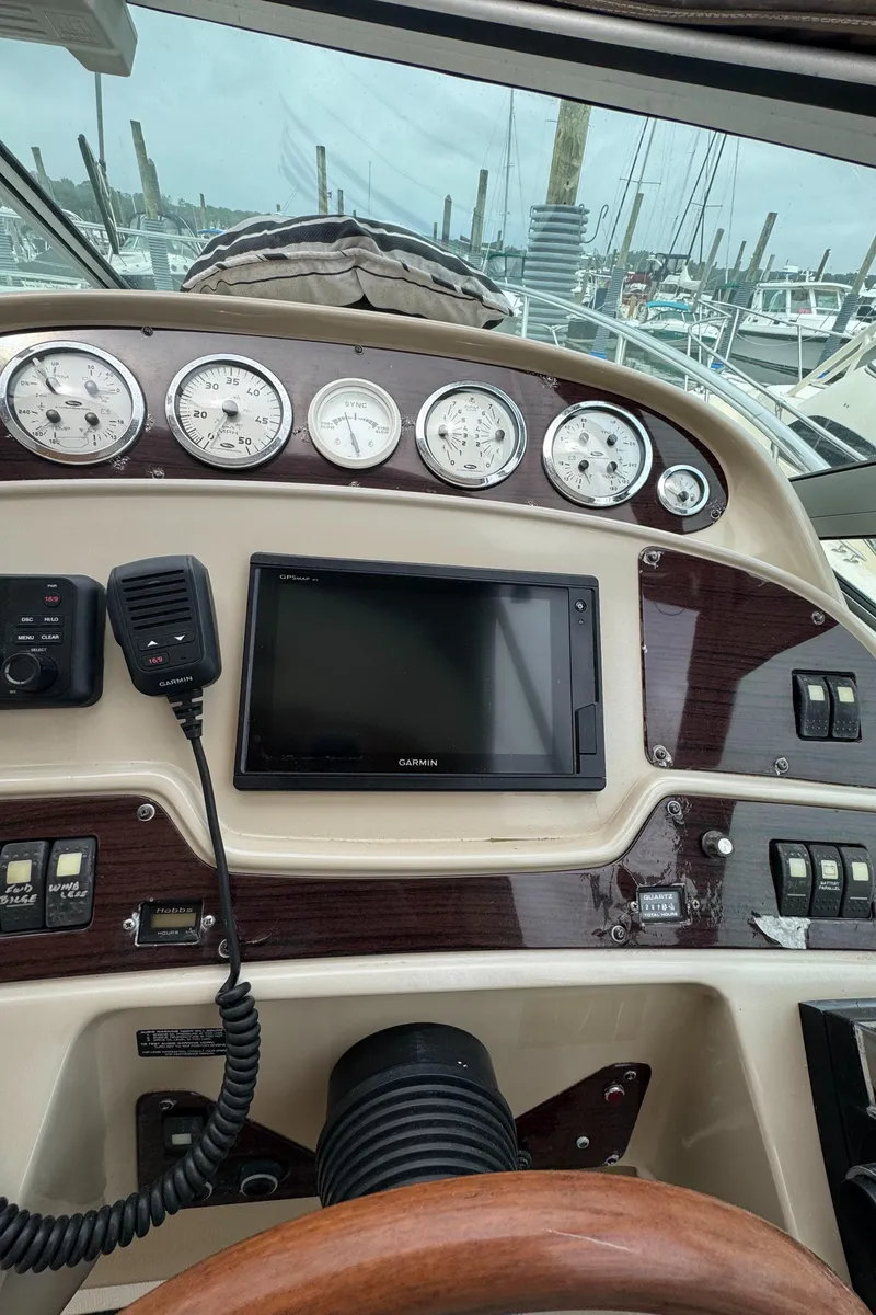Slide: The Image of Control panel of a 2004 Chaparral 330 Signature boat with gauges and navigation equipment. - 5