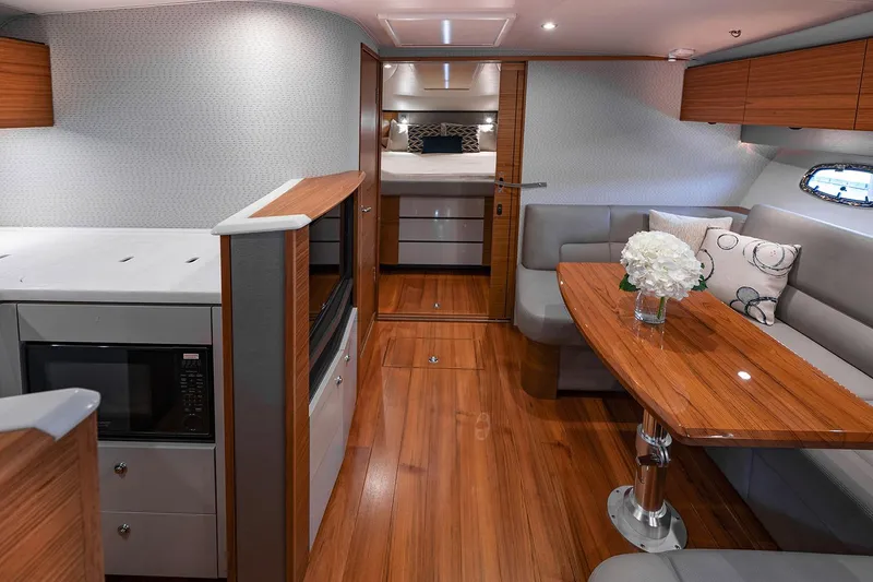 Slide: The Image of Manufacturer Provided Image: 2022 Tiara Yachts 39 Open interior with modern kitchen and cozy dining area. - 11