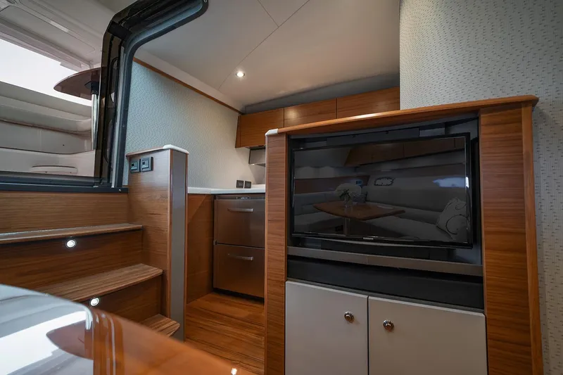 Slide: The Image of Manufacturer Provided Image: 2022 Tiara Yachts 39 Open interior with modern kitchen and entertainment area. - 12