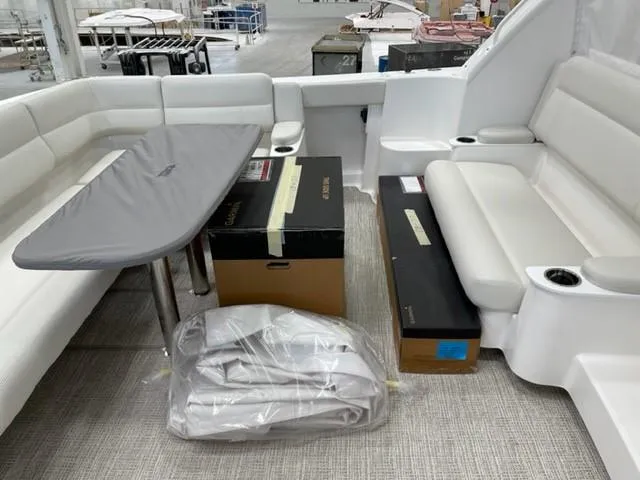 Slide: The Image of 2022 Tiara Yachts 39 Open interior with seating, table, and packaged accessories. - 19