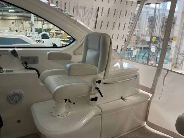 Slide: The Image of 2022 Tiara Yachts 39 Open helm seat in a modern boat interior. - 2