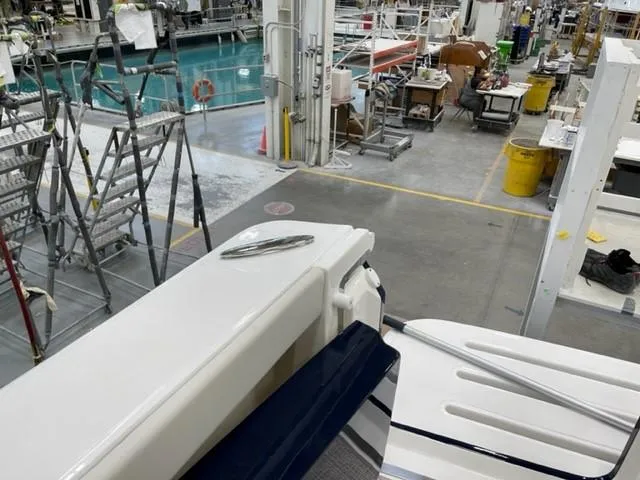 Slide: The Image of 2022 Tiara Yachts 39 Open in a boat manufacturing facility. - 20