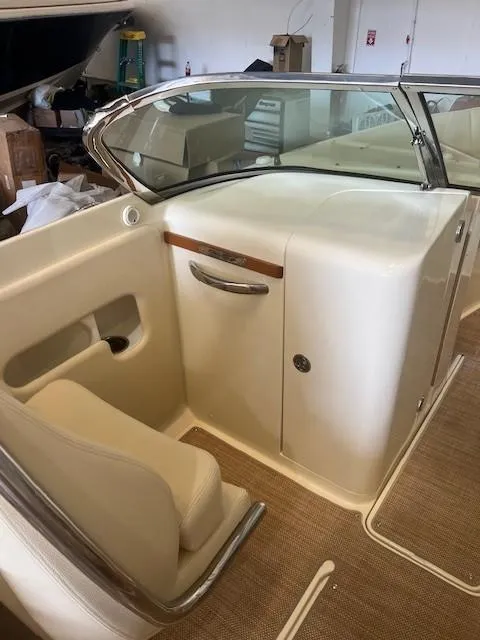 Slide: The Image of 2020 Chris-Craft Launch 27 interior with beige seating and sleek dashboard design. - 13