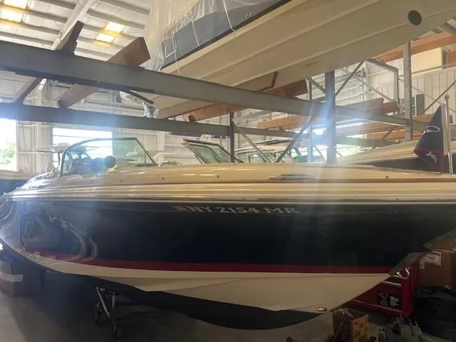 Slide: The Image of 2020 Chris-Craft Launch 27 boat in storage, side view. - 5