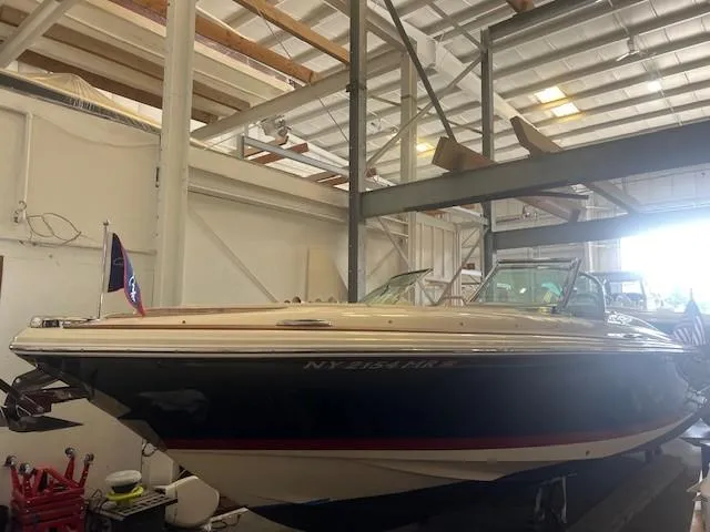Slide: The Image of 2020 Chris-Craft Launch 27 boat in indoor storage facility. - 6