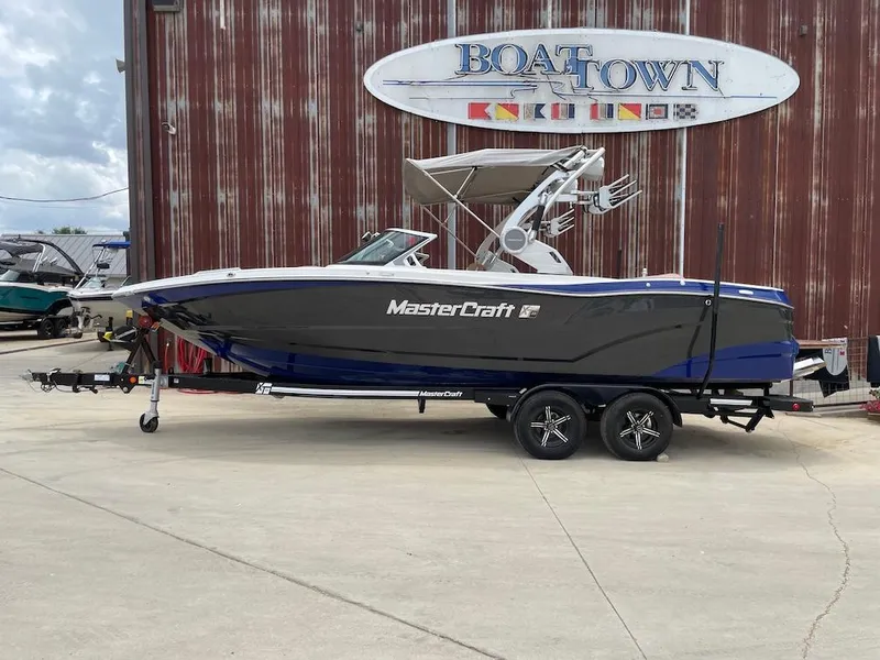 The Image of 2019 MasterCraft XT23 boat on trailer at Boat Town dealership. - 0