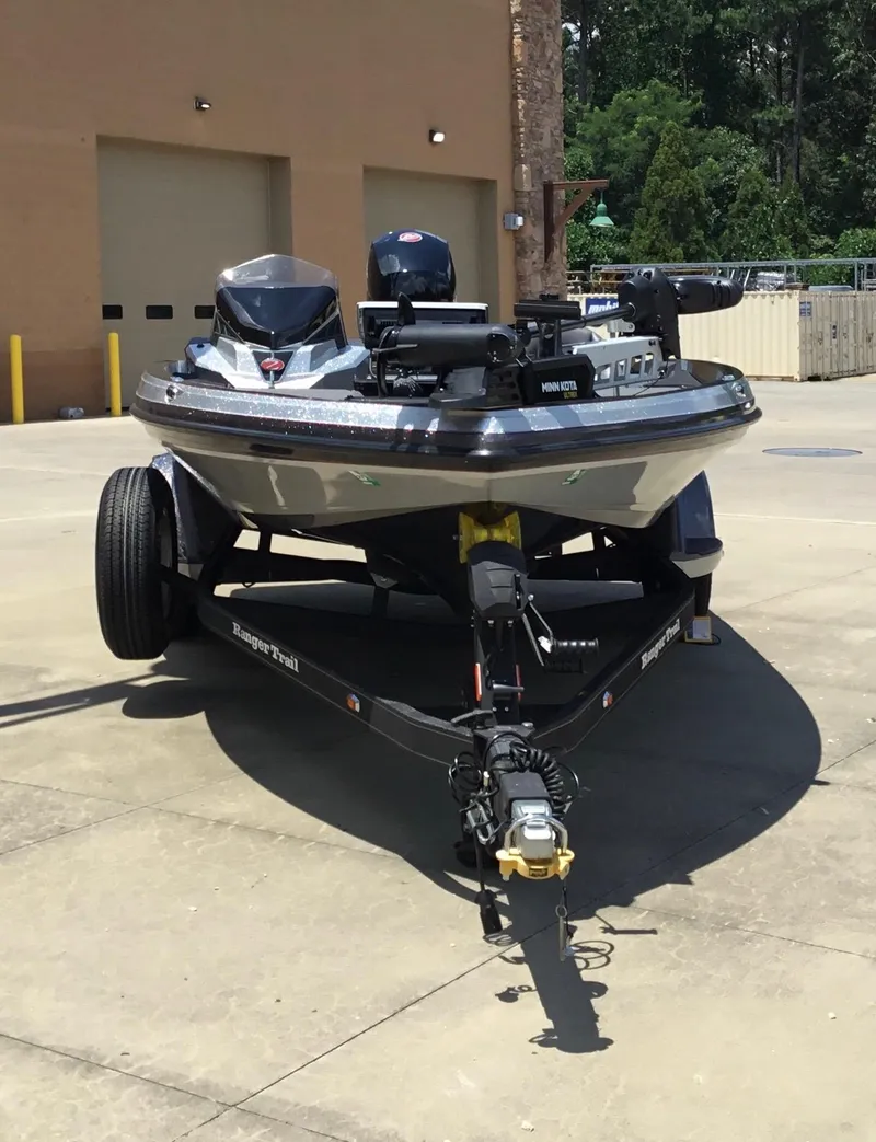Slide: The Image of 2023 Ranger Z518 boat on trailer in outdoor setting. - 0