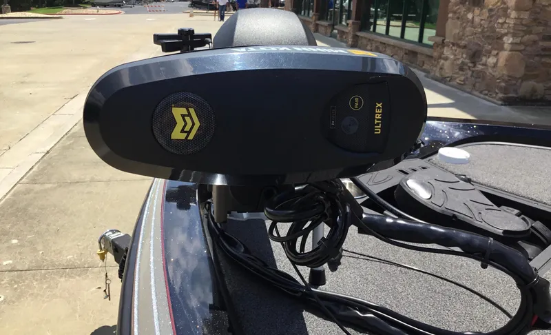 Slide: The Image of 2023 Ranger Z518 boat with Ultrex trolling motor, parked outdoors. - 3