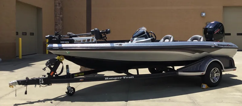 Slide: The Image of 2023 Ranger Z518 boat on trailer, parked outdoors, featuring sleek design and modern equipment. - 4