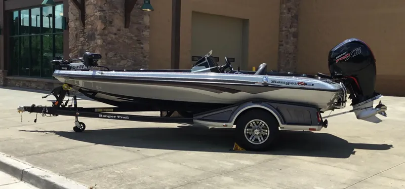 Slide: The Image of 2023 Ranger Z518 boat on trailer, parked outdoors, side view. - 5