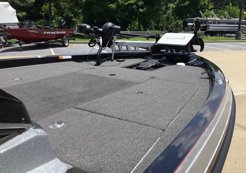 Slide: The Image of 2023 Ranger Z518 boat deck with Garmin equipment, parked outdoors. - 9