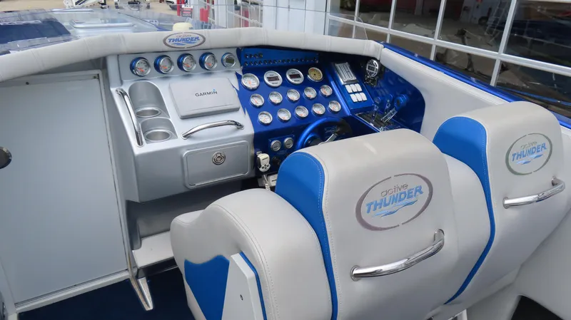 Slide: The Image of 2007 Active Thunder 37 boat cockpit with Garmin navigation and dual seats. - 12