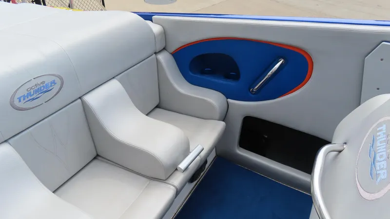 Slide: The Image of 2007 Active Thunder 37 boat interior with gray and blue seating, logo visible. - 14