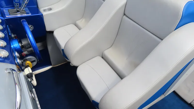 Slide: The Image of Interior of a 2007 Active Thunder 37 boat with white and blue seating. - 15