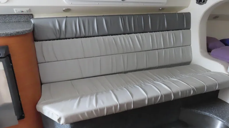 Slide: The Image of 2007 Active Thunder 37 boat interior with gray leather seating and modern design. - 24