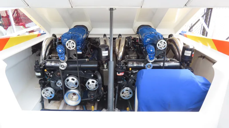 Slide: The Image of 2007 Active Thunder 37 boat engine compartment with dual high-performance engines. - 27
