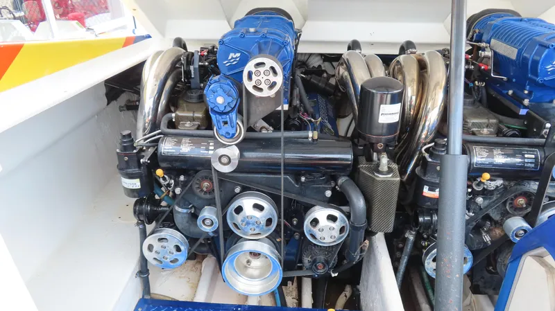 Slide: The Image of Engine compartment of a 2007 Active Thunder 37 boat, featuring a powerful marine engine. - 28