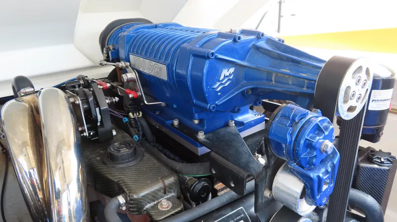 Slide: The Image of High-performance engine of a 2007 Active Thunder 37 boat, featuring a blue 700 SCi supercharger. - 29