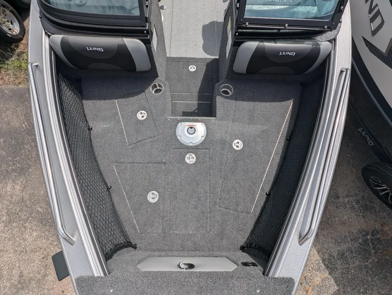 Slide: The Image of 2025 Lund 1975 Tyee boat interior, featuring spacious seating and modern design. - 11