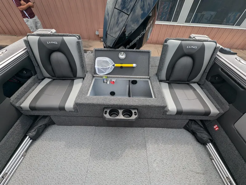 Slide: The Image of 2025 Lund 1975 Tyee boat interior with seating and storage compartments. - 15