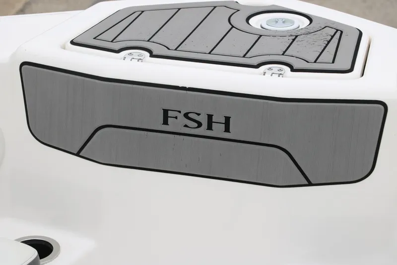 Slide: The Image of 2019 Yamaha Boats 210 FSH Sport, close-up of deck detail with "FSH" label. - 14