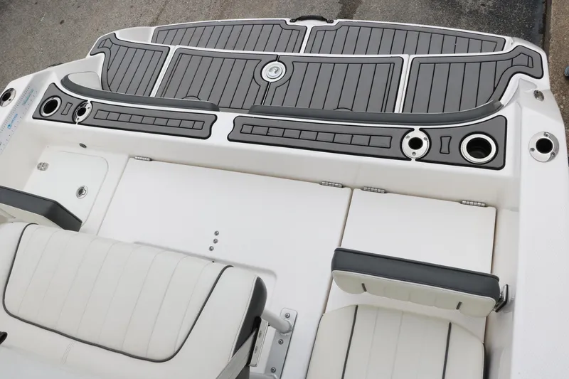 Slide: The Image of 2019 Yamaha Boats 210 FSH Sport deck with seating and cup holders. - 20