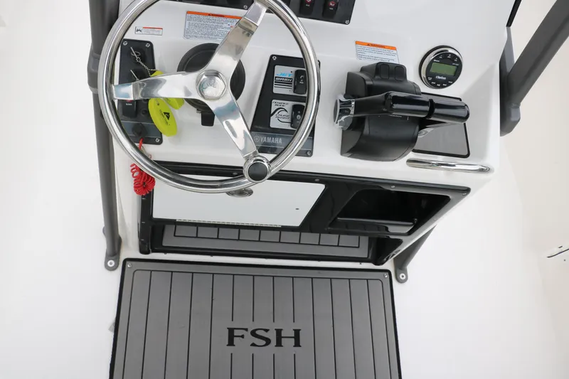Slide: The Image of 2019 Yamaha Boats 210 FSH Sport dashboard with steering wheel and controls. - 21