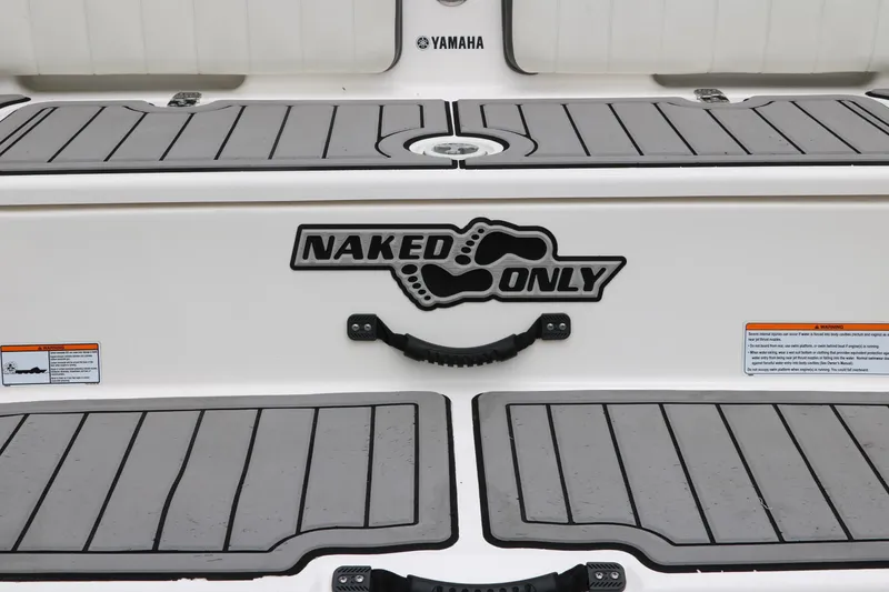 Slide: The Image of 2019 Yamaha Boats 210 FSH Sport with "Naked Only" decal on deck. - 28