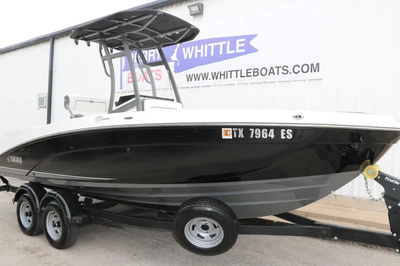 Slide: The Image of 2019 Yamaha Boats 210 FSH Sport on trailer at Whittle Boats dealership. - 4