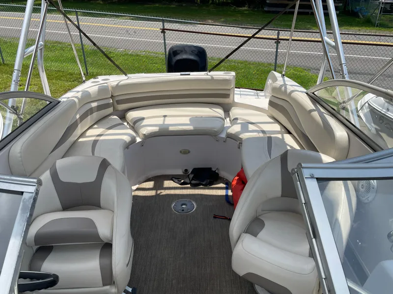 Slide: The Image of 2007 Starcraft 2410 OB Limited boat interior with beige seating and carpeted floor. - 14