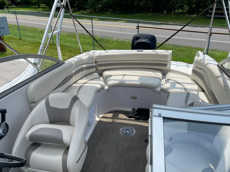Slide: The Image of 2007 Starcraft 2410 OB Limited boat interior with beige seating and carpeted floor. - 15
