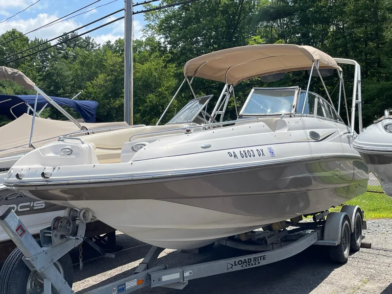 Slide: The Image of 2007 Starcraft 2410 OB Limited boat on trailer, parked outdoors. - 6